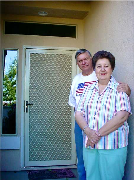 Older couple standing in front of Centurion Security Screen Door Customers
