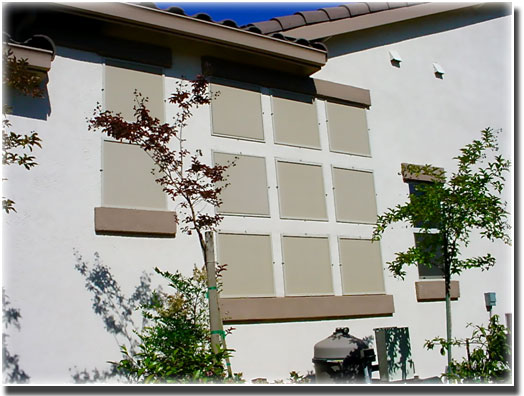 Custom Beige Solar Screens in windows of home