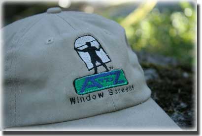 close up of baseball hat that says A to Z window screens with logo of a man holding a screen