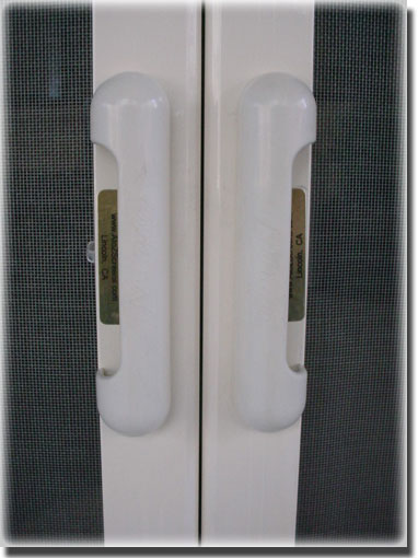 close up of white Double French Screen Door Handles