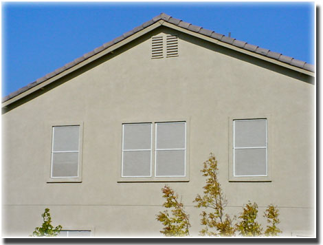 Stucco Privacy Screens on windows of home