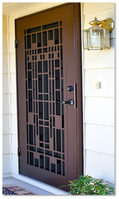 Brown security door with light on to the right ton front porch