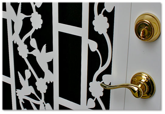 White security door with gold door handle and lock