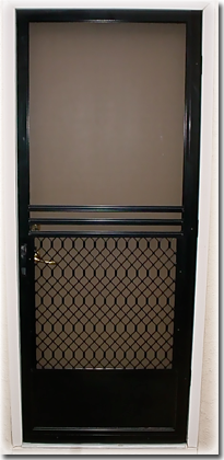 Black Screen door with metal pattern on bottom half