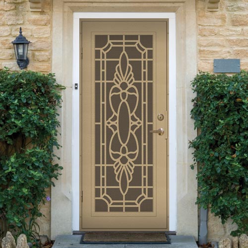 brown security door on home with decoritve pattern bushes on each side of the door