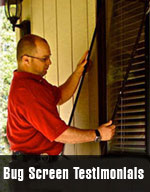 Man in red shirt and glasses adding a screen to a window