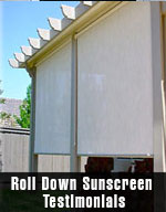 two outdoor screens that are rolled down